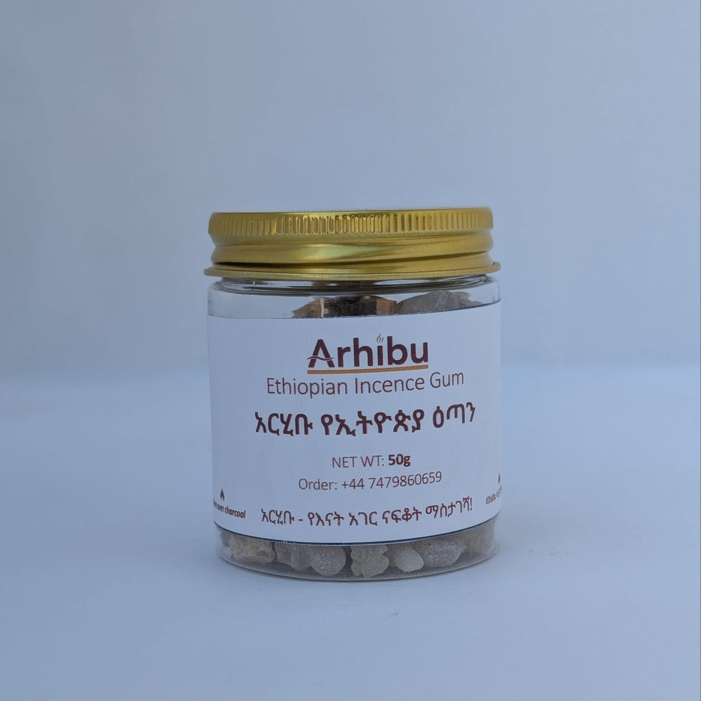 A small clear plastic jar of Arhibu Ethiopian Incense Gum with a gold metal lid and a white label, set against a plain light grey background.