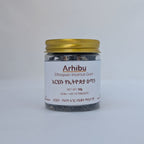 A small glass jar of Arhibu Ethiopian Incense Gum with a gold metal lid and a white label, set against a plain light gray background.