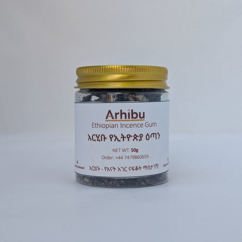 A small glass jar of Arhibu Ethiopian Incense Gum with a gold metal lid and a white label, set against a plain light gray background.